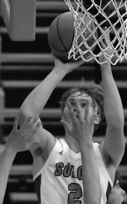 Austin Knight puts up two points against Marion Friday, Dec. 15, 2023, at home.